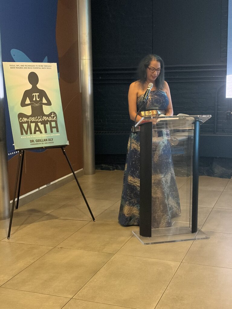 Dr. Geillan Aly reading from her book Compassionate Math
